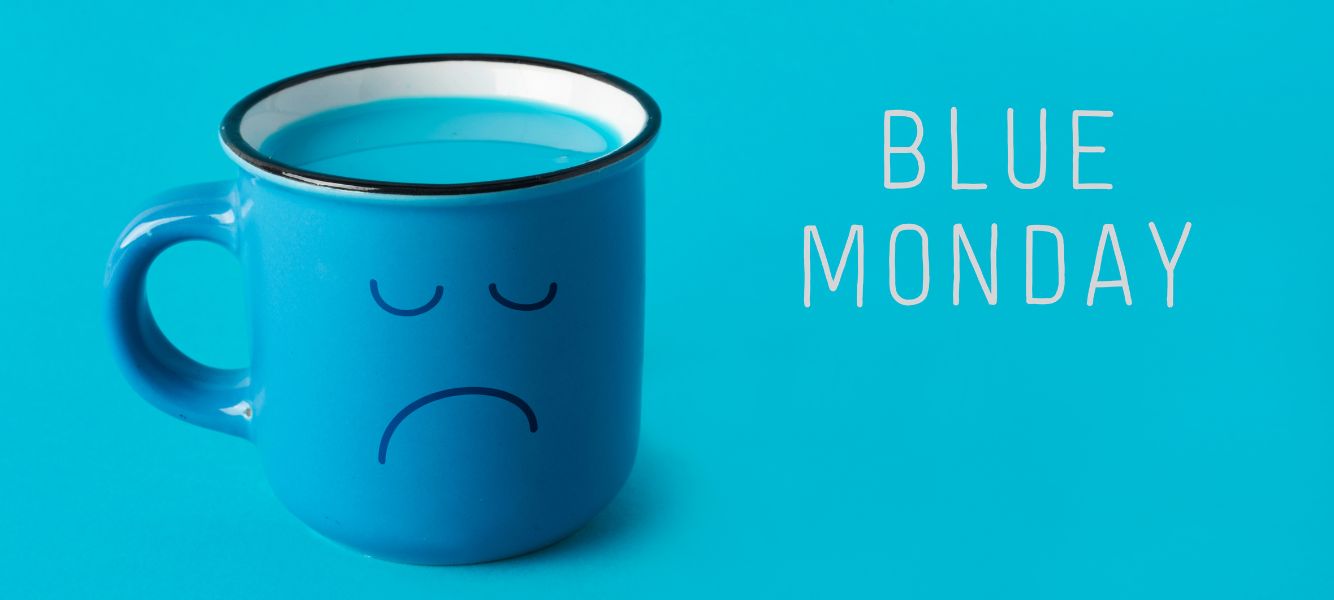 a graphic of a blue mug with the word blue monday next to it on the mental health at work blog