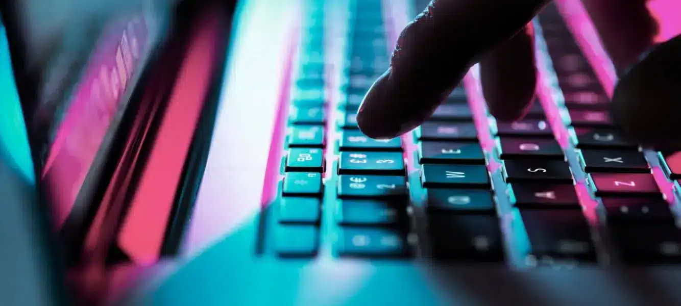 an image of a hand on a computer keyboard on a blog entitled 4 common cyber threats