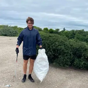 astute people's james barker takes part in the beach clean