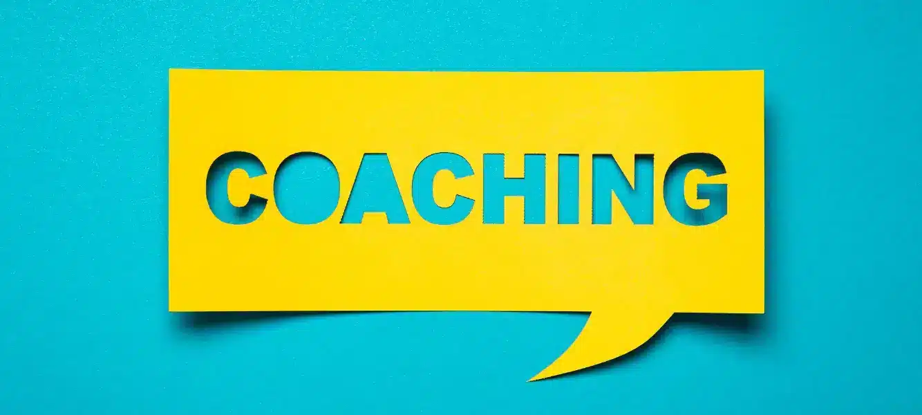 coaching: the new retention strategy. An image of a yellow cut-out that says Coaching