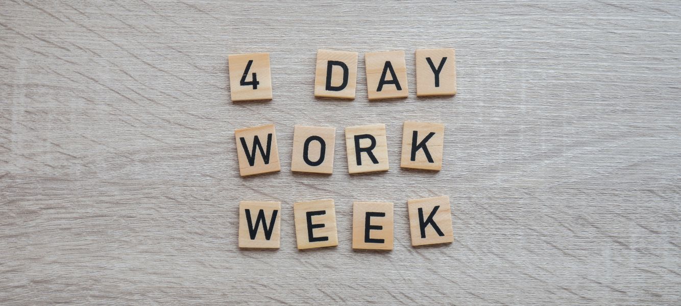 a graphic with tiles that spell out four-day work week on the blog four-day working week