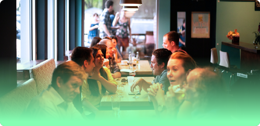 an image of people sat in a restaurant eating