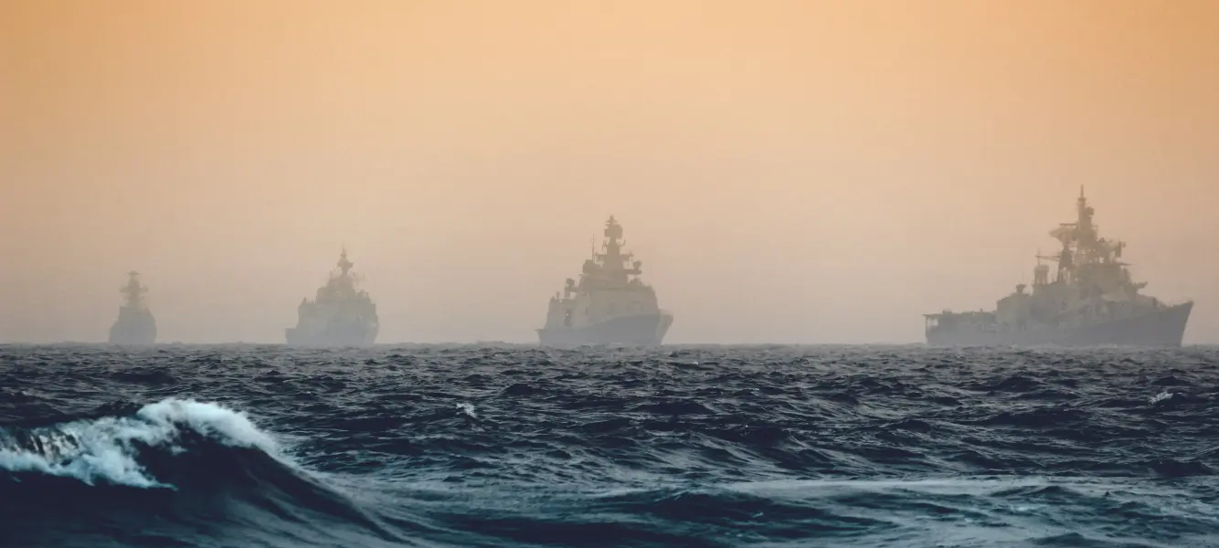 an image of four naval ships at sea for a blog on the armed forces covenant