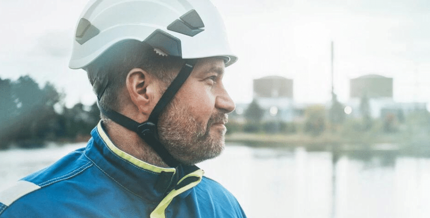 a fortum worker looks out to the right