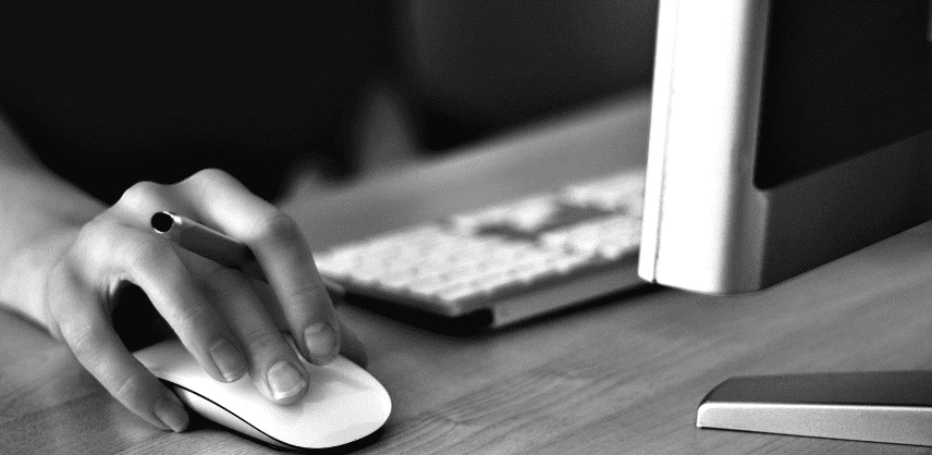 an image of a person's hand using a mouse while they are sat at a computer on the website of specialist energy recruiter Astute People